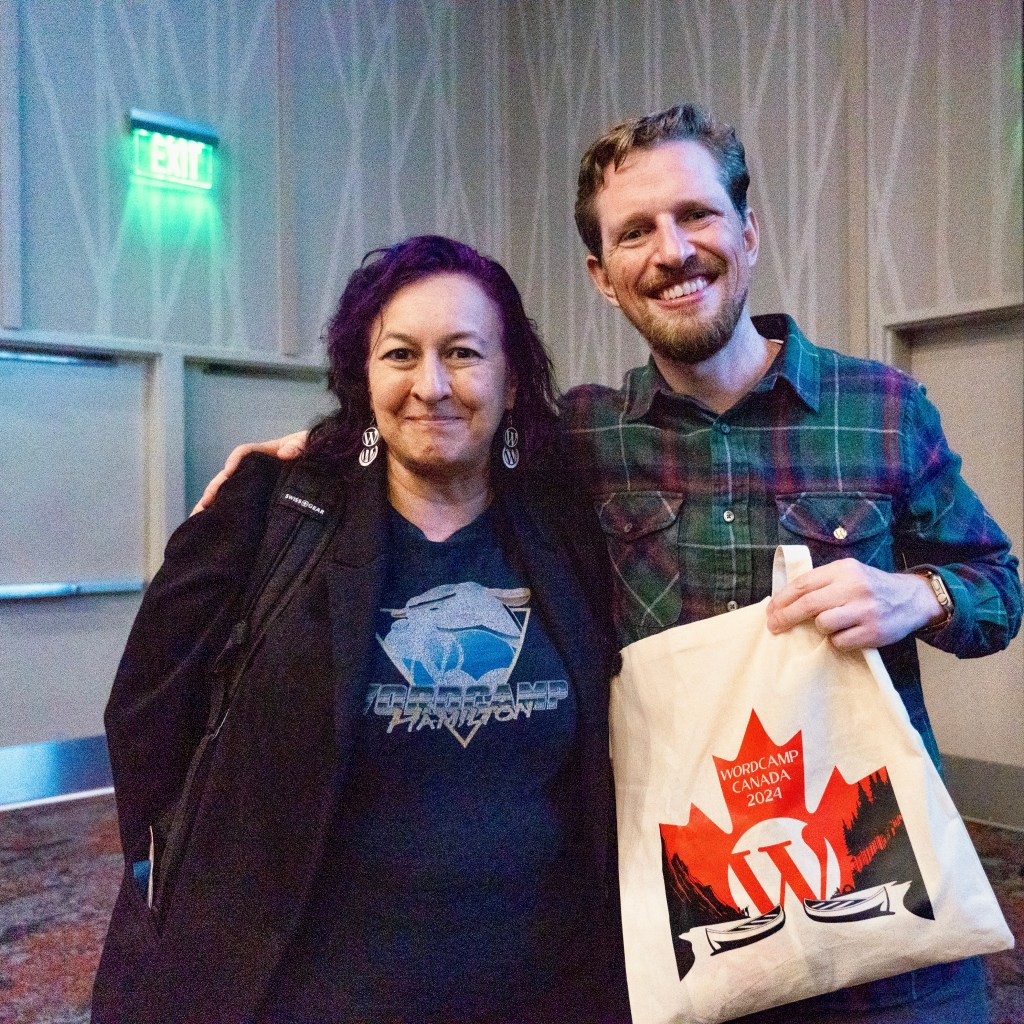 Shanta gives Matt a WCEH 2024 bag at WCUS 2024